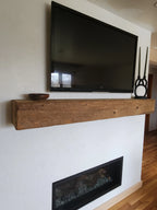 Rustic wood hand hewn barn beam mantel custom made with a reclaimed aged distressed antique look