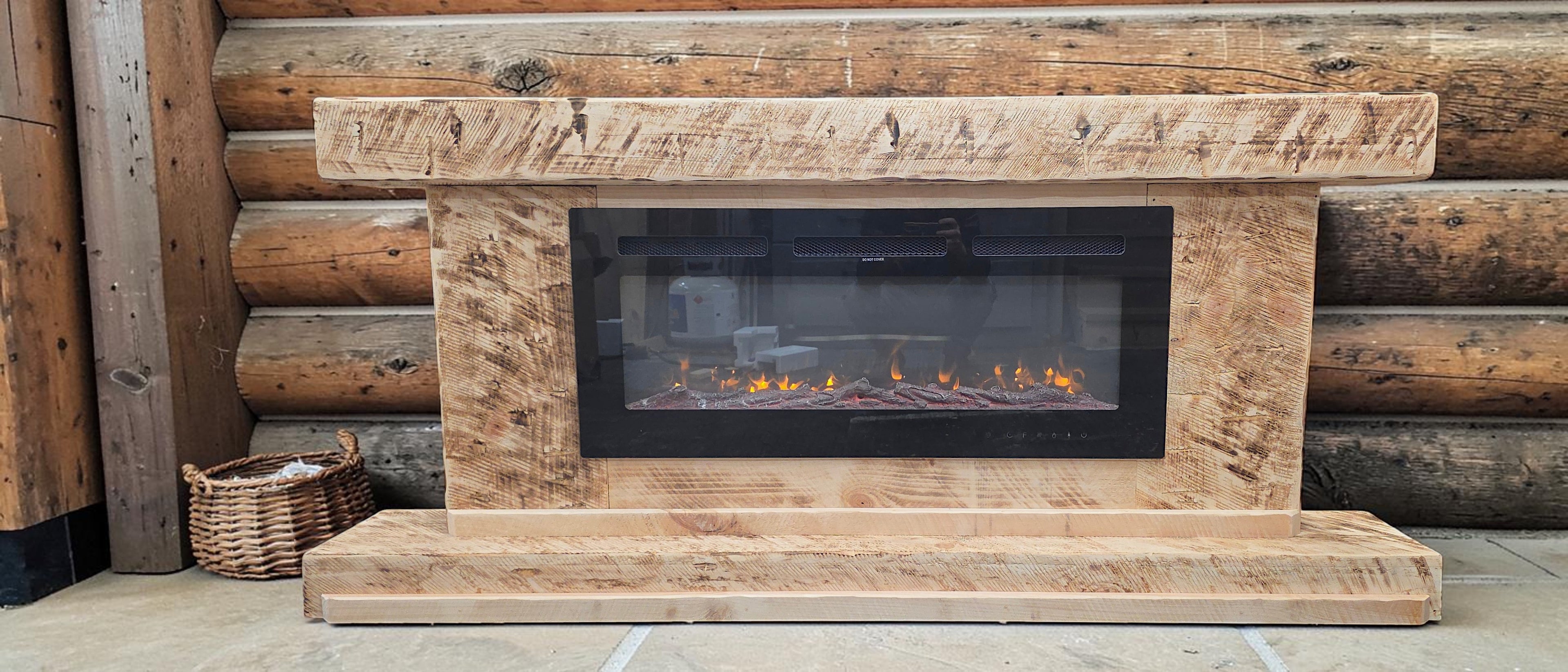 Rustic hand hewn wood freestanding fireplace to hold an LED electric fake fireplace